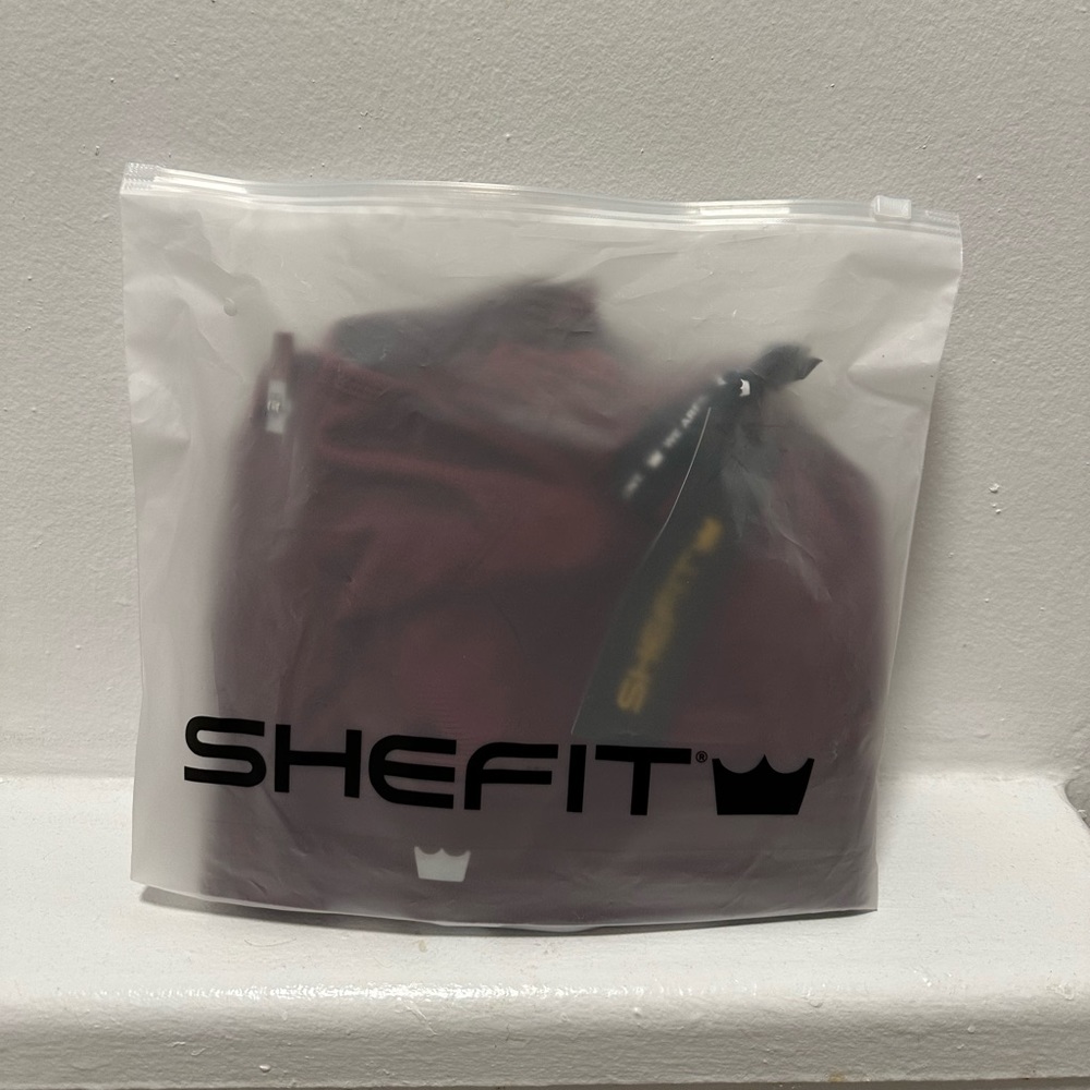 Brand new never worn wine colored Shefit Ultimate sports bra size 1 luxe.